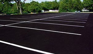 An empty, freshly paved parking lot