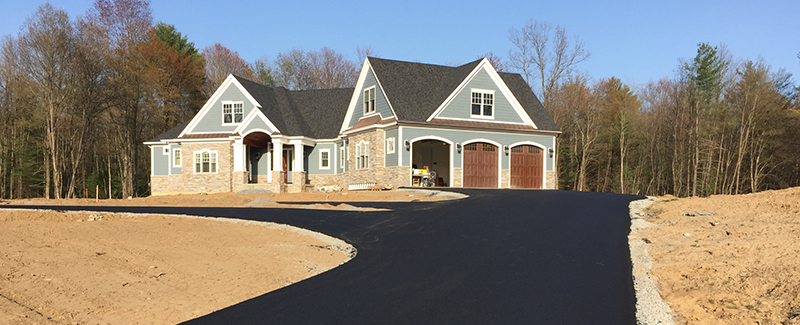 A house with a newly-paved driveway